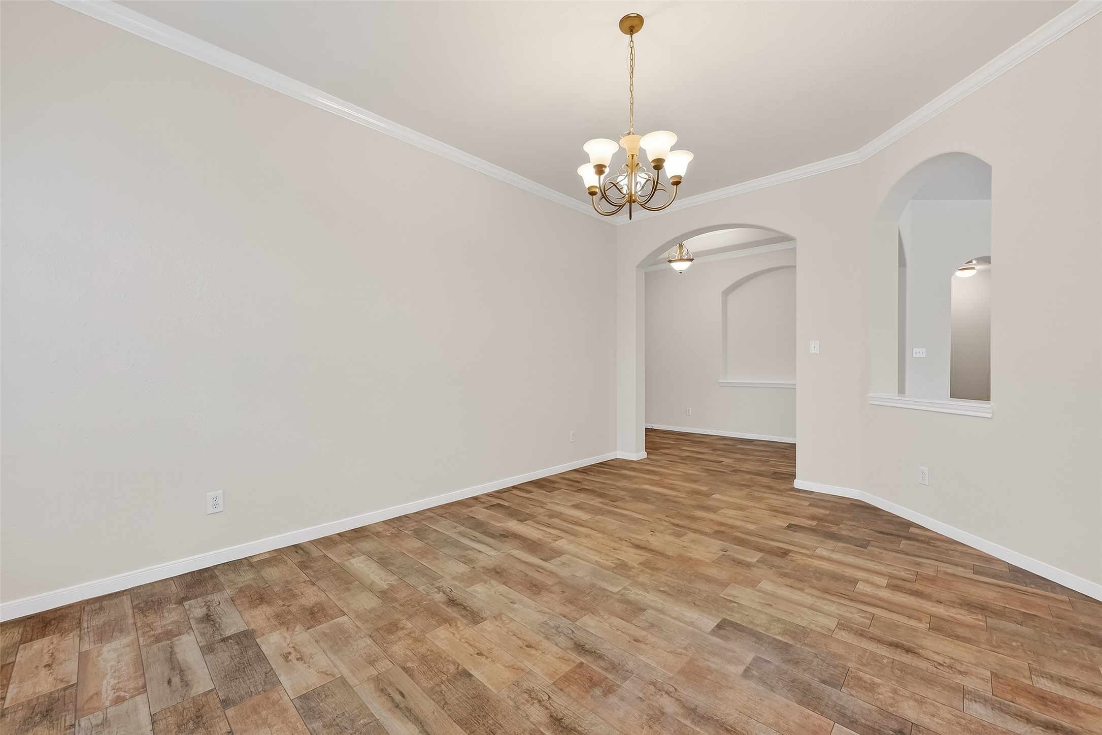 78 South Archwyck Circle Spring, TX 77382 - Photo 11 of 47 a view of an empty room with a chandelier