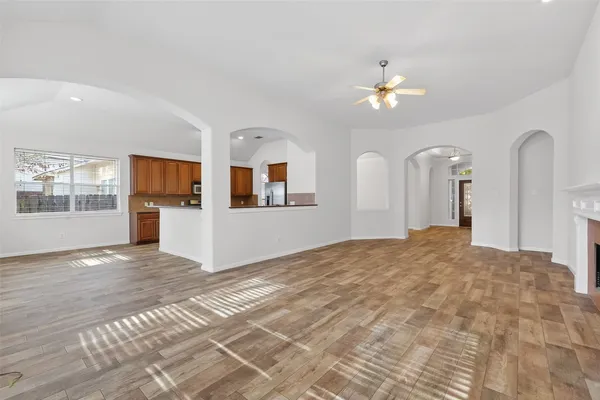 a view of empty room with fireplace