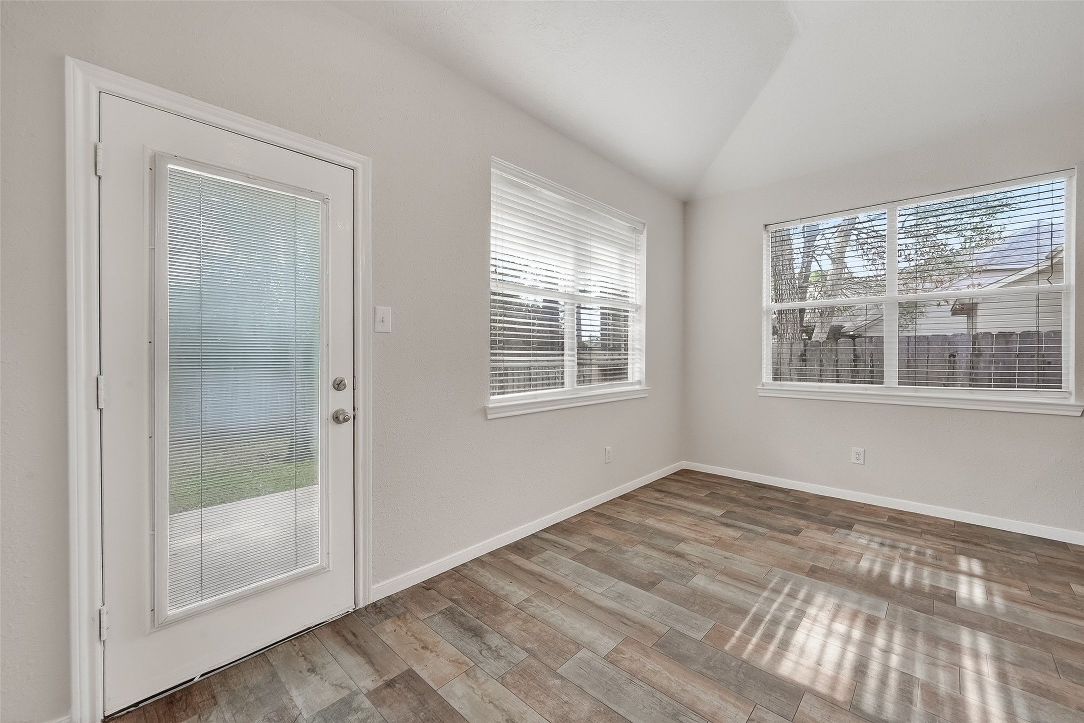 78 South Archwyck Circle Spring, TX 77382 - Photo 18 of 47 a view of empty room with window and wooden floor