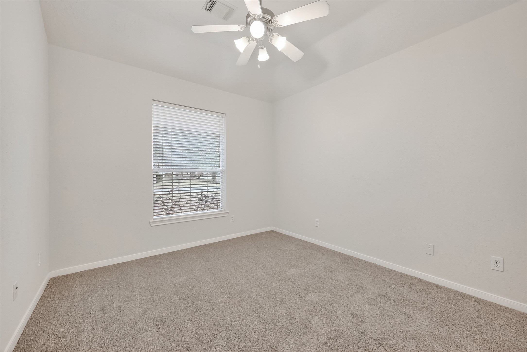78 South Archwyck Circle Spring, TX 77382 - Photo 29 of 47 an empty room with a window and a fan