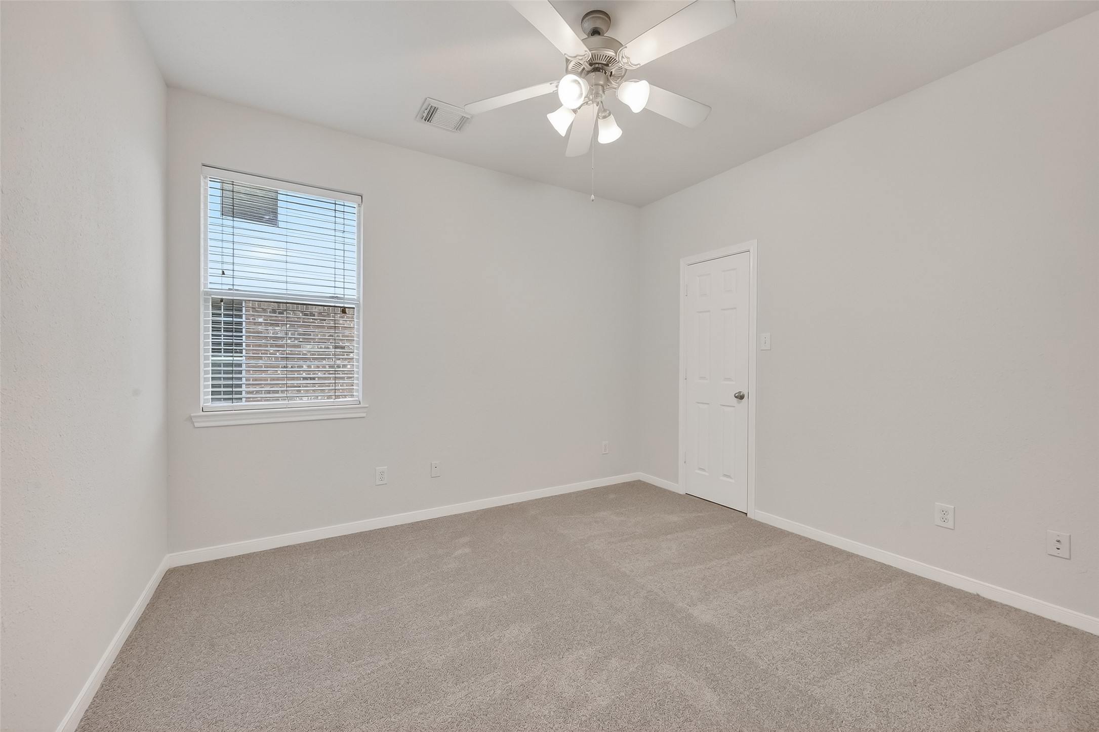 78 South Archwyck Circle Spring, TX 77382 - Photo 33 of 47 an empty room with a window and a fan
