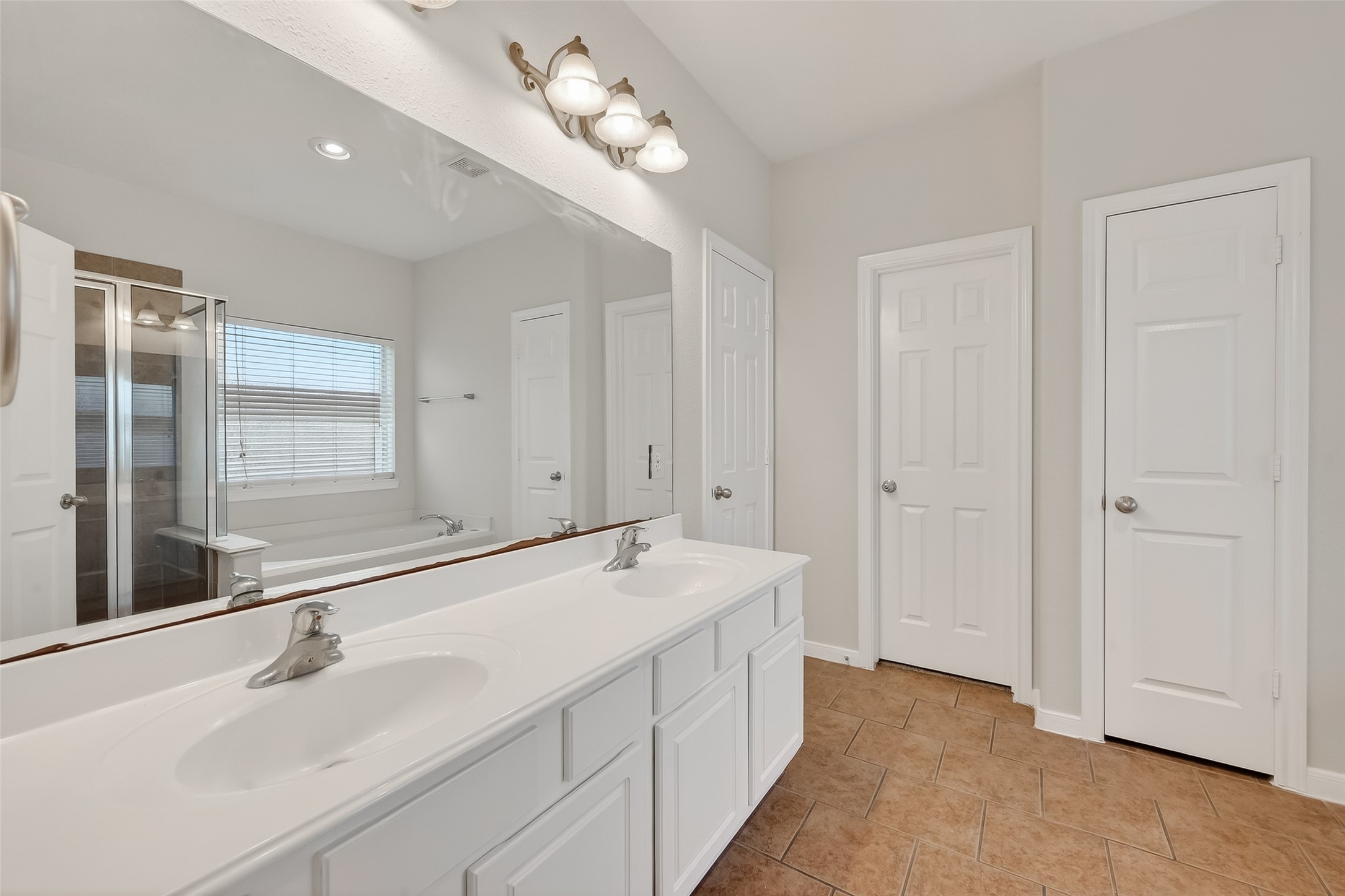 78 South Archwyck Circle Spring, TX 77382 - Photo 38 of 47 a bathroom with a double vanity sink and a mirror