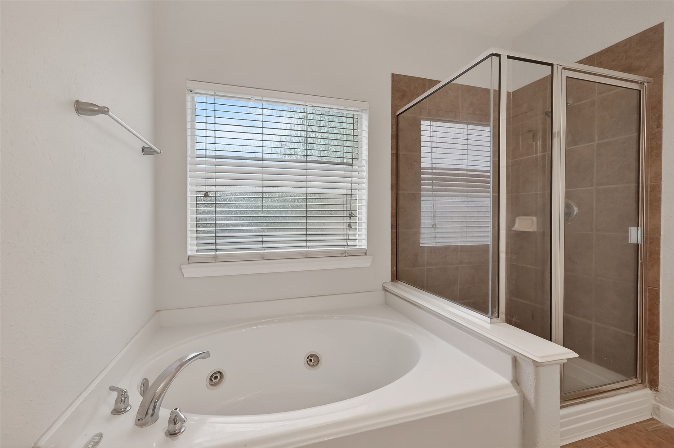 78 South Archwyck Circle Spring, TX 77382 - Photo 40 of 47 a bathroom with a tub and a shower