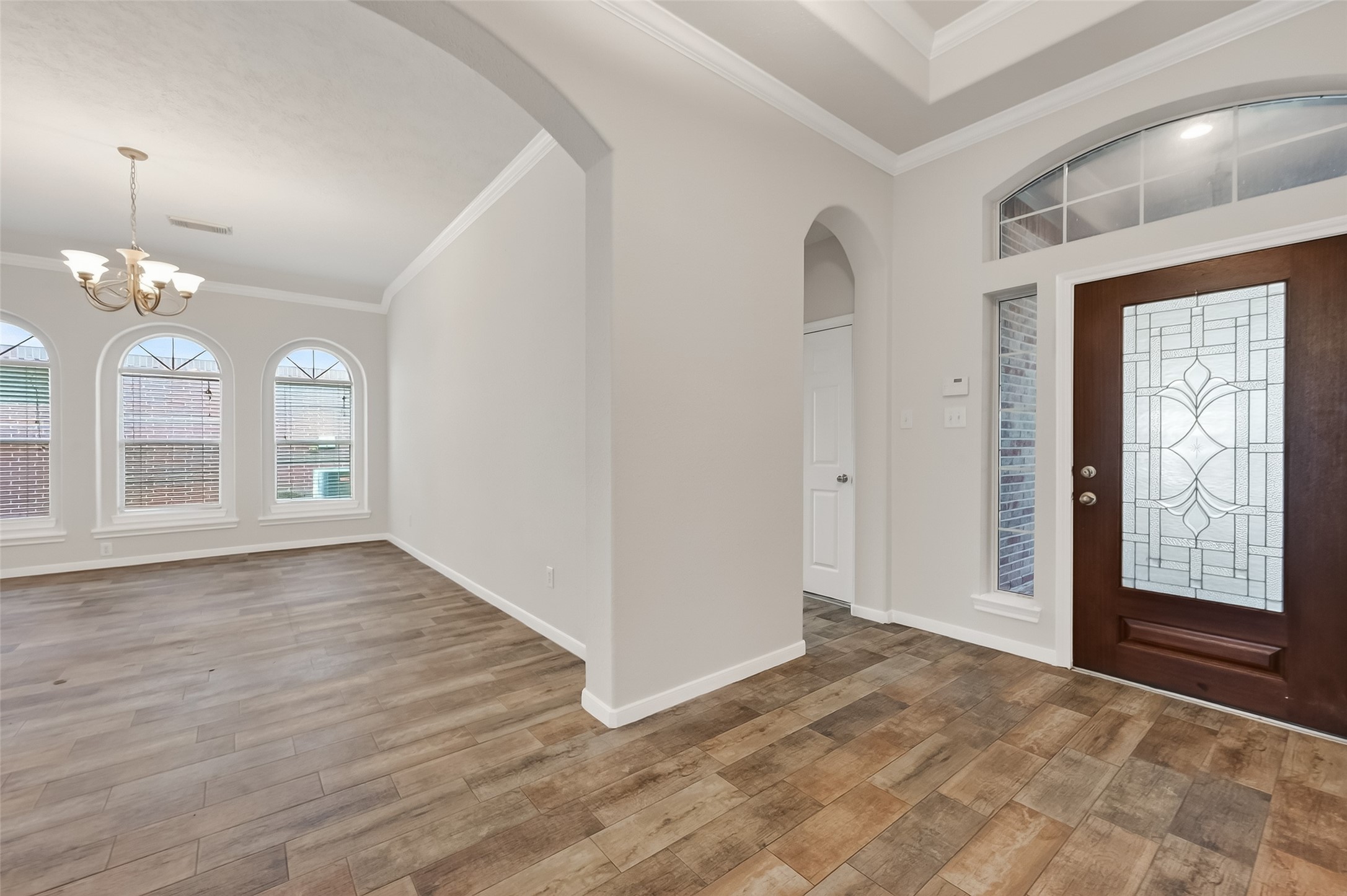 78 South Archwyck Circle Spring, TX 77382 - Photo 8 of 47 a view of an empty room with window and wooden floor