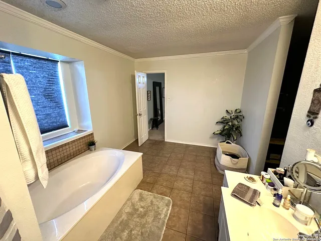 a view of a living room with furniture and a floor to ceiling window