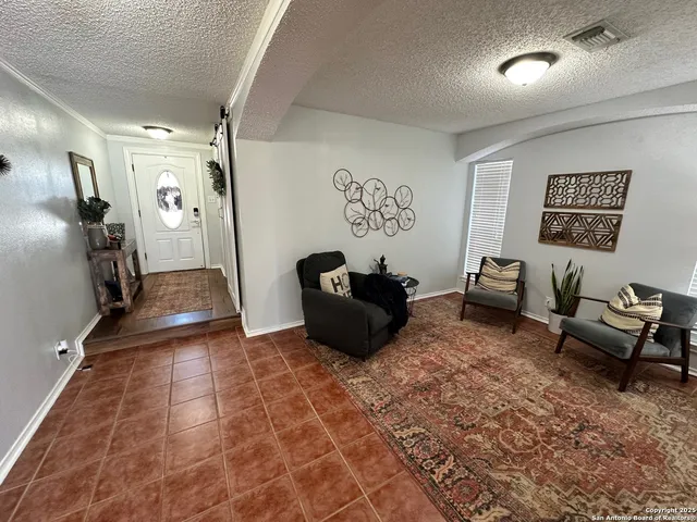 a bedroom with furniture and wooden floor
