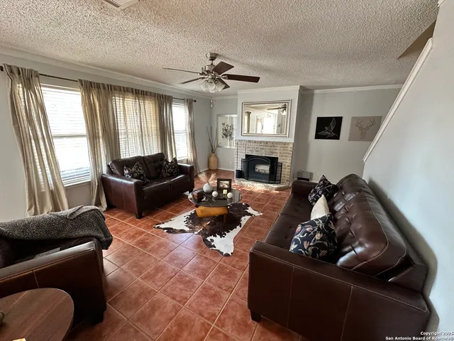 a kitchen with refrigerator a sink a stove a microwave and island