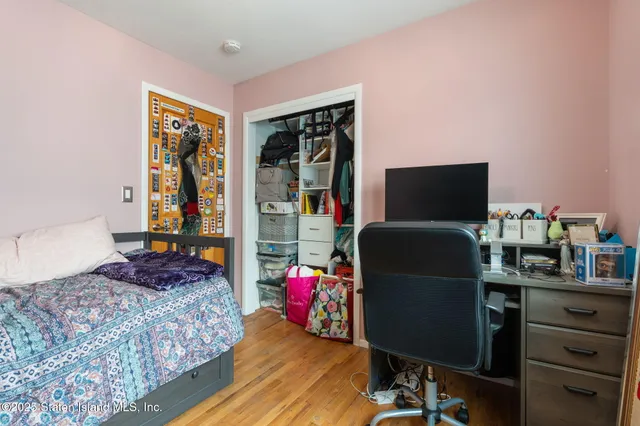 a bedroom with a workspace