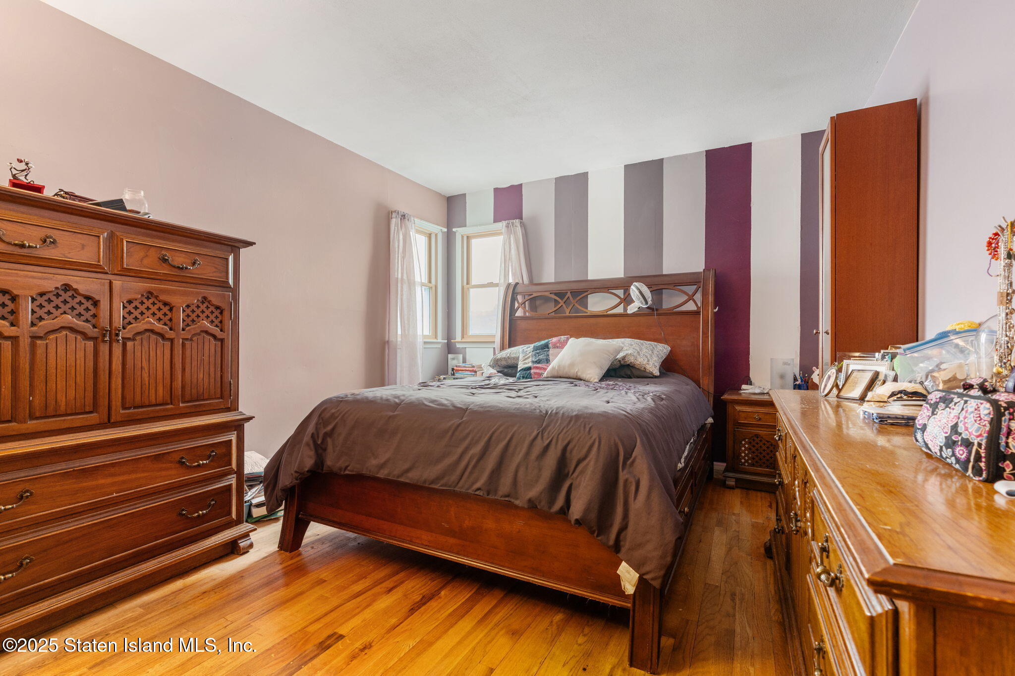 735 Sheldon Avenue Staten Island, NY 10312 - Photo 13 of 29 a bedroom with a bed and wooden floor
