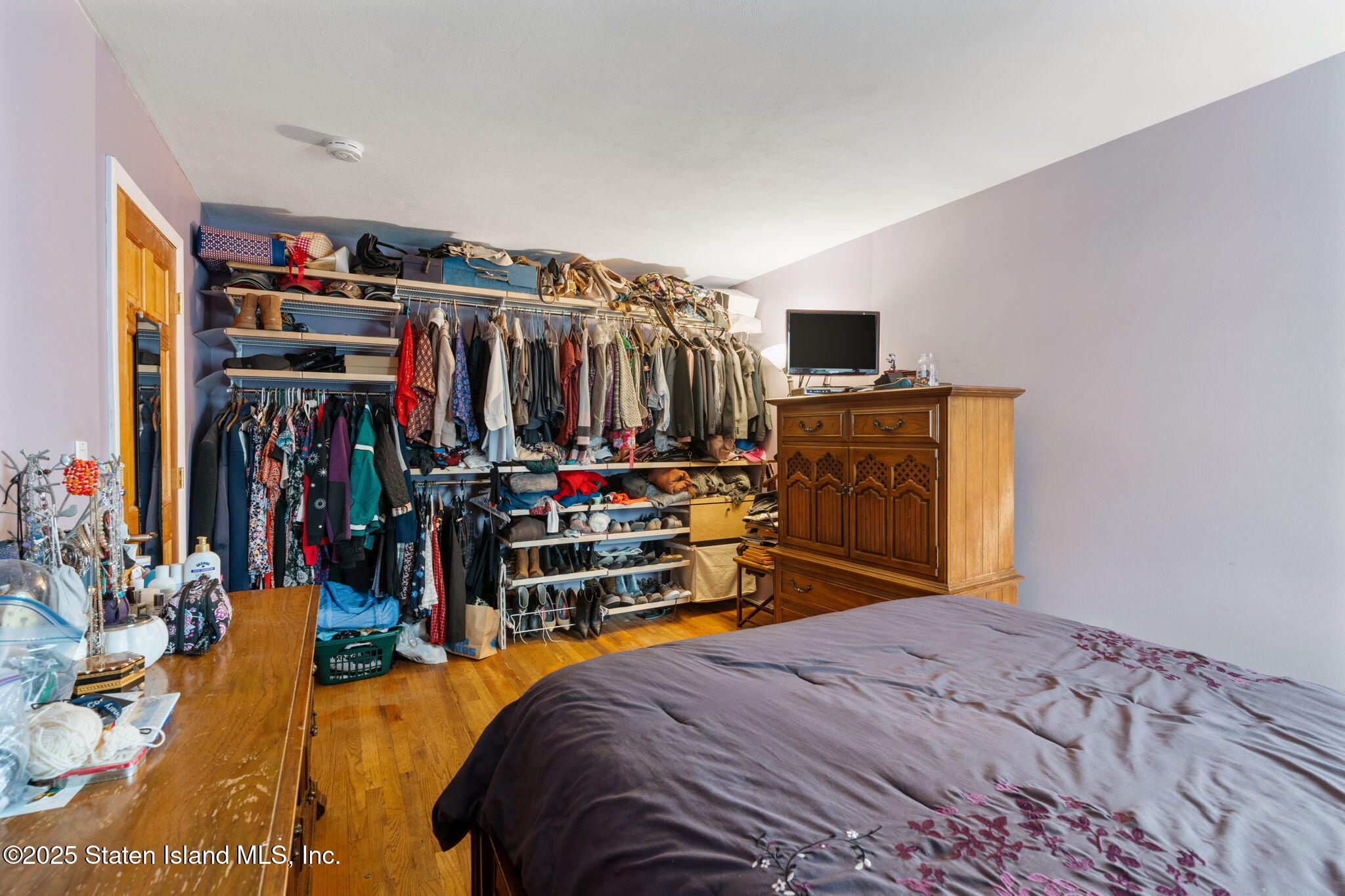 735 Sheldon Avenue Staten Island, NY 10312 - Photo 14 of 29 a bedroom with bed and a closet