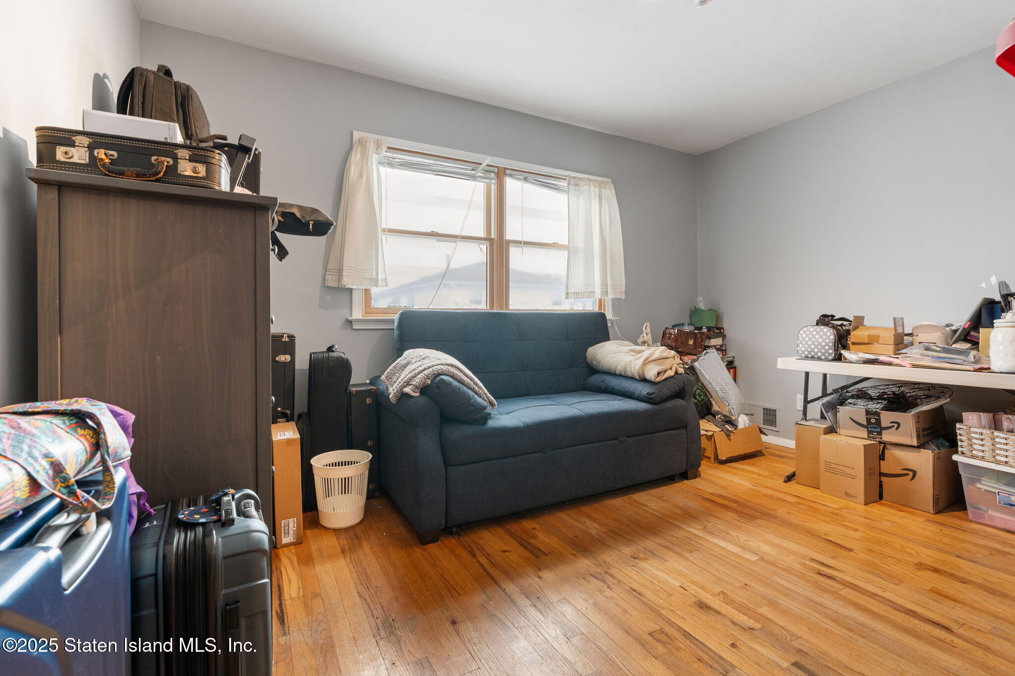 735 Sheldon Avenue Staten Island, NY 10312 - Photo 15 of 29 a living room with furniture and a window