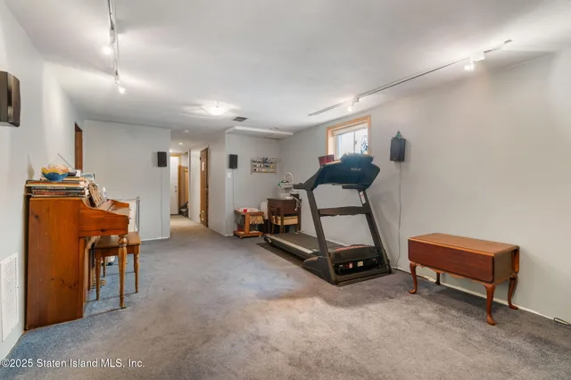 a room with furniture and air hockey table