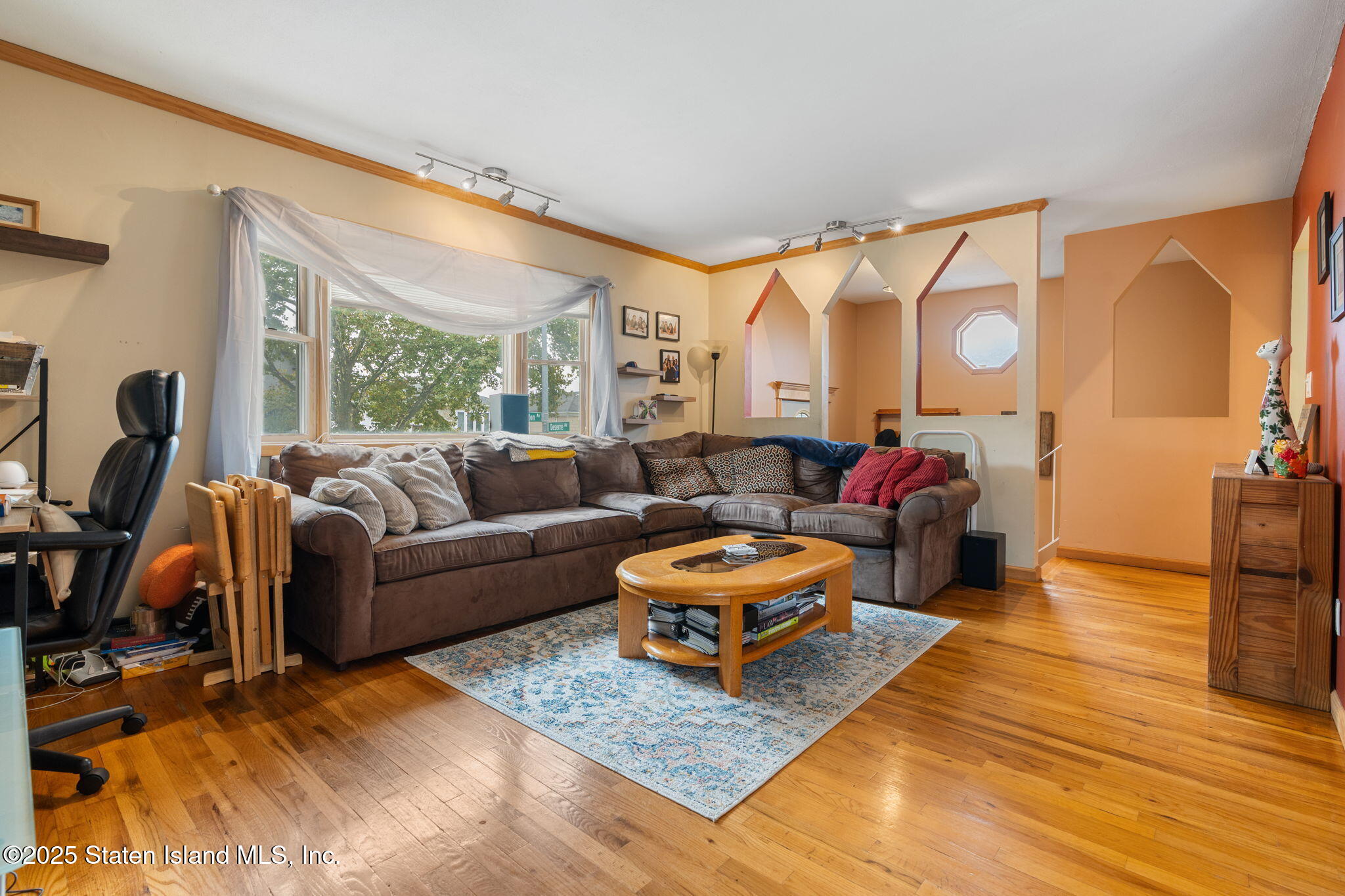 735 Sheldon Avenue Staten Island, NY 10312 - Photo 2 of 29 a living room with furniture a rug and a large window