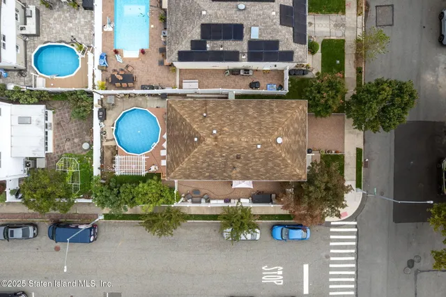 an aerial view of a house with garden space and sitting space