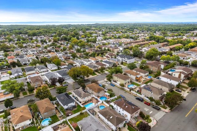 an aerial view of residential building with parking space