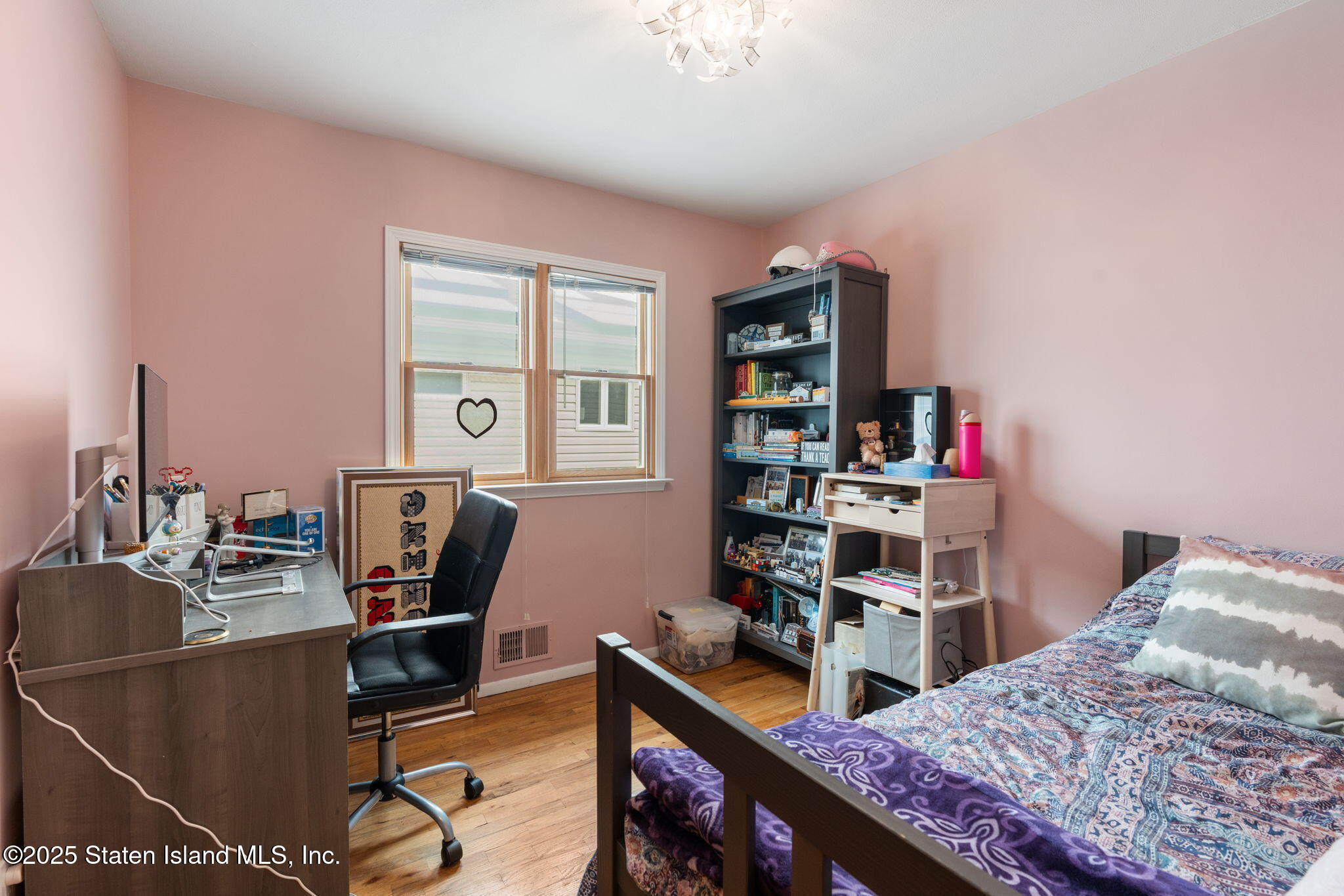 735 Sheldon Avenue Staten Island, NY 10312 - Photo 10 of 29 a view of a workspace with furniture and a bookshelf