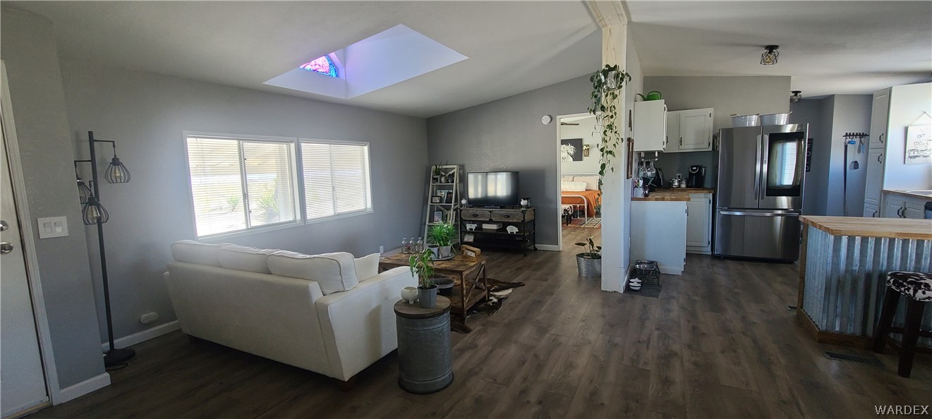 2821 Naco Road Golden Valley, AZ 86413 - Photo 11 of 71 a living room with furniture and a window
