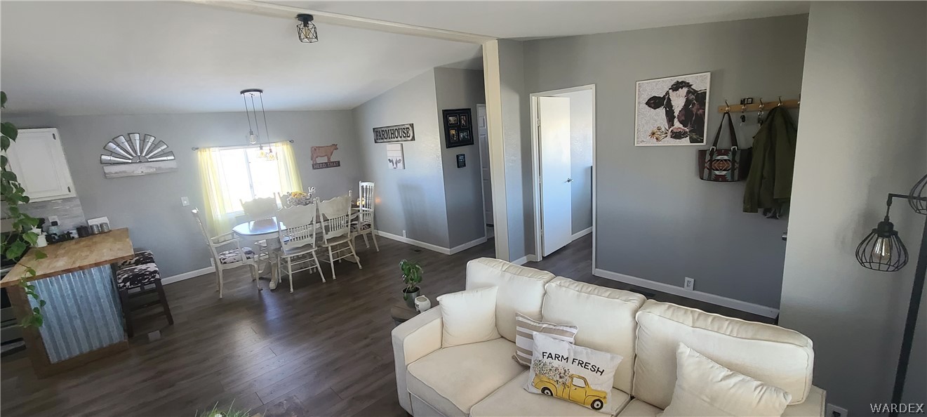2821 Naco Road Golden Valley, AZ 86413 - Photo 13 of 71 a living room with furniture and wooden floor