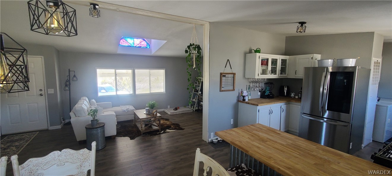 2821 Naco Road Golden Valley, AZ 86413 - Photo 17 of 71 a living room with furniture and a flat screen tv