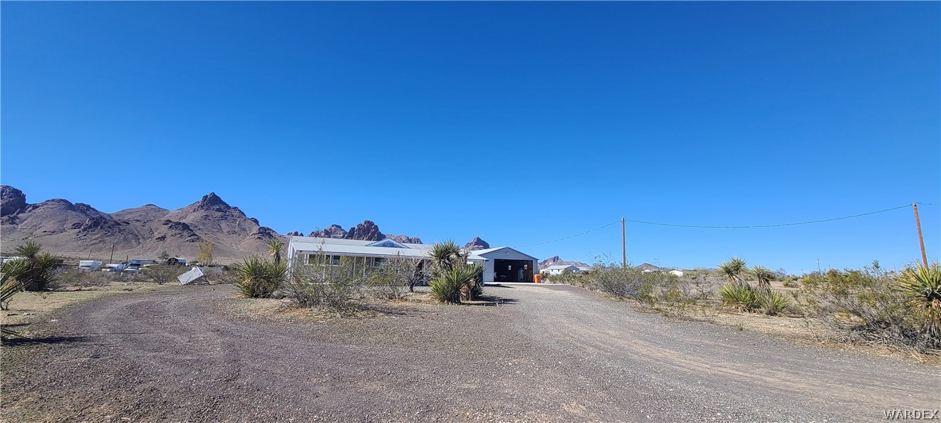 2821 Naco Road Golden Valley, AZ 86413 - Photo 2 of 71 a view of a road with a building in the background