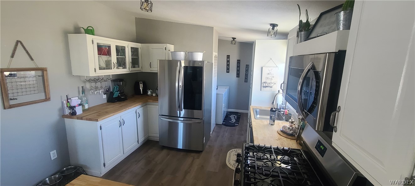 2821 Naco Road Golden Valley, AZ 86413 - Photo 27 of 71 a kitchen with stainless steel appliances granite countertop a refrigerator and a stove