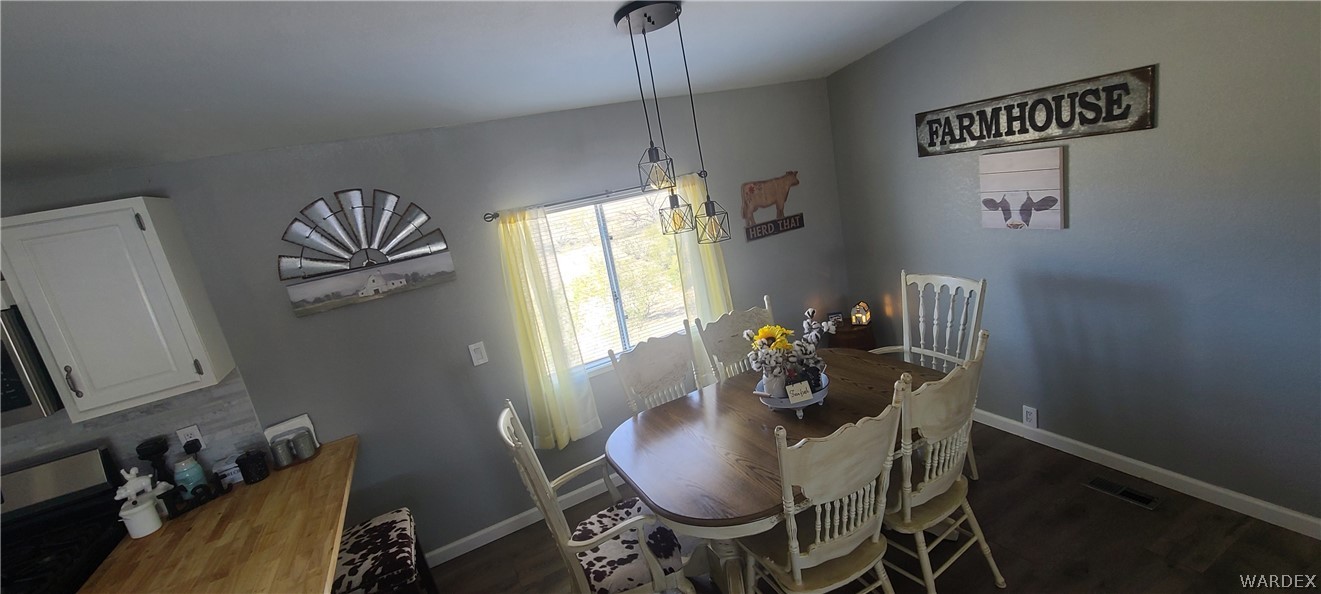 2821 Naco Road Golden Valley, AZ 86413 - Photo 31 of 71 a dining room with furniture and window