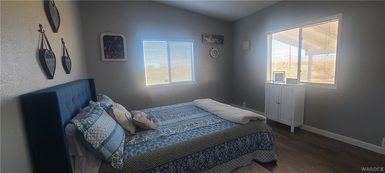 2821 Naco Road Golden Valley, AZ 86413 - Photo 52 of 71 a bed sitting in a bedroom next to a window
