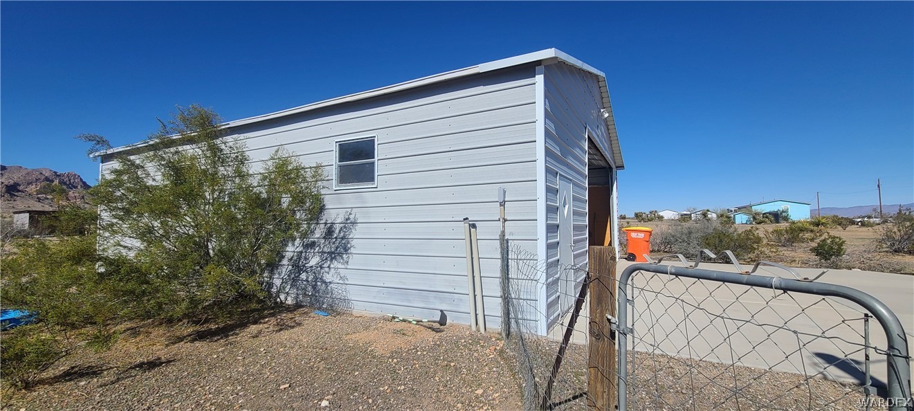 2821 Naco Road Golden Valley, AZ 86413 - Photo 59 of 71 a view of a house with a yard
