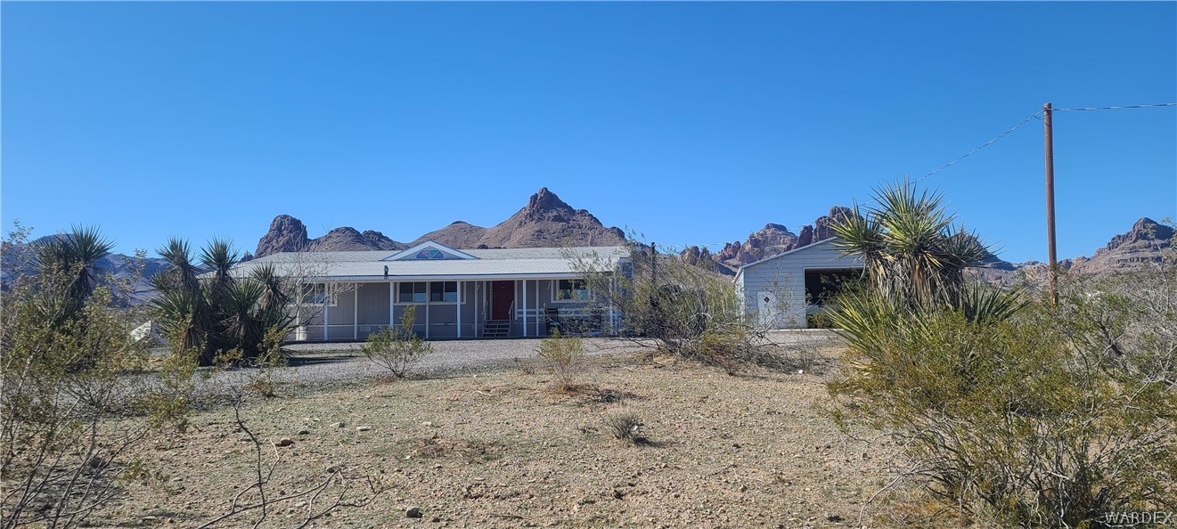 2821 Naco Road Golden Valley, AZ 86413 - Photo 6 of 71 a front view of a house with a yard