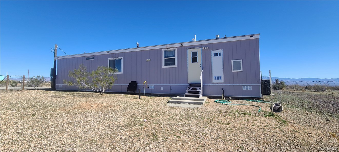 2821 Naco Road Golden Valley, AZ 86413 - Photo 61 of 71 a front view of a house with a yard