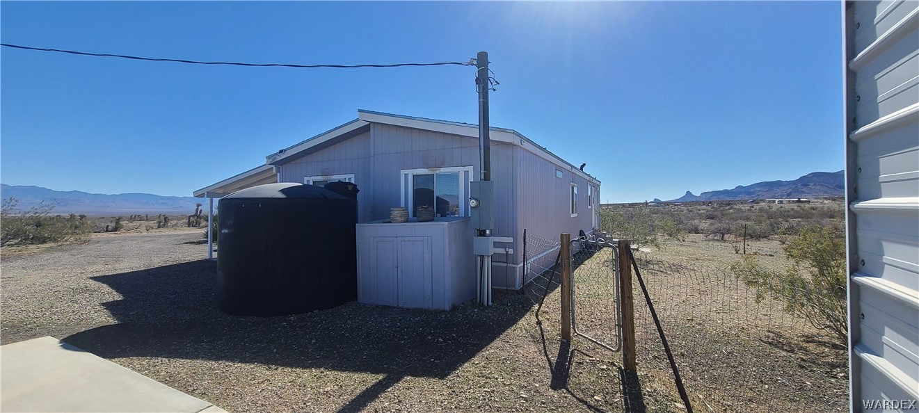2821 Naco Road Golden Valley, AZ 86413 - Photo 64 of 71 a front view of a house with a yard