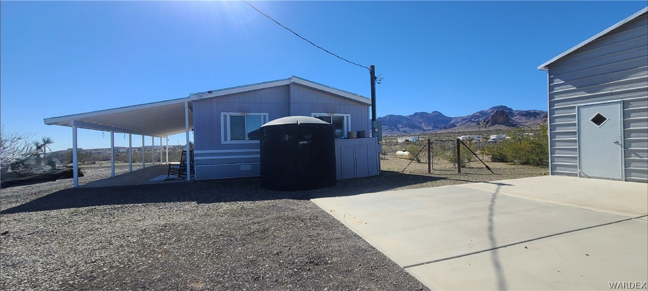 2821 Naco Road Golden Valley, AZ 86413 - Photo 65 of 71 a front view of a house with a yard
