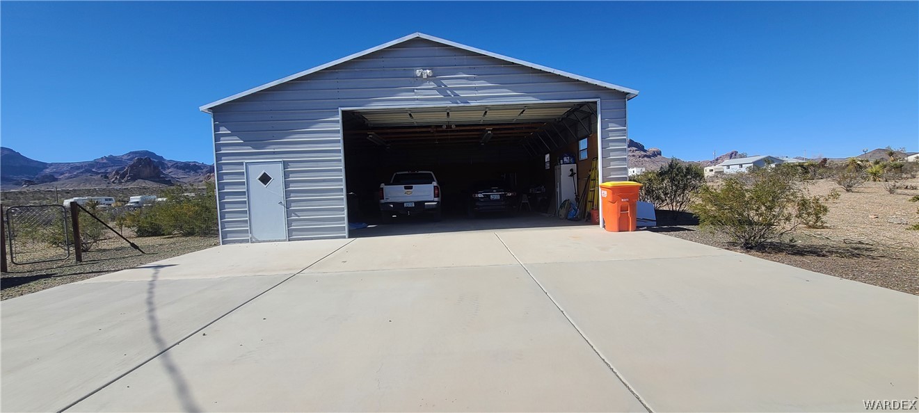 2821 Naco Road Golden Valley, AZ 86413 - Photo 67 of 71 a front view of a house with a yard