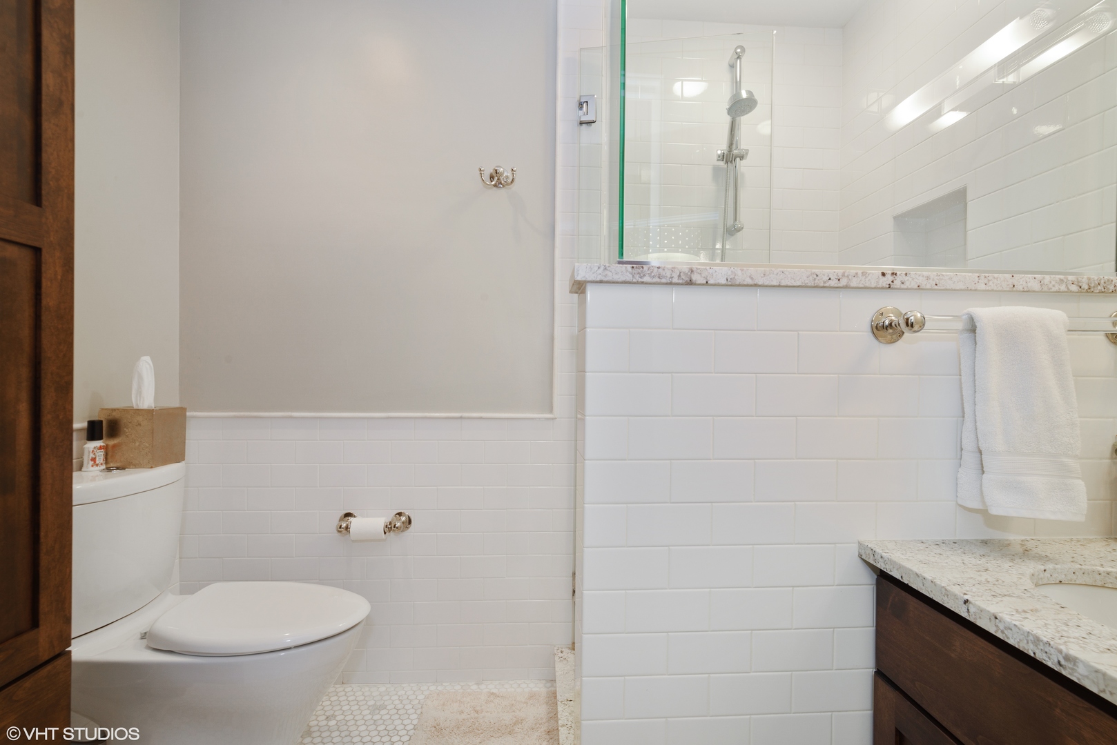 3100 North Sheridan Road, Unit 7D Chicago, IL 60657 - Photo 14 of 24 a bathroom with a granite countertop sink a toilet and a mirror