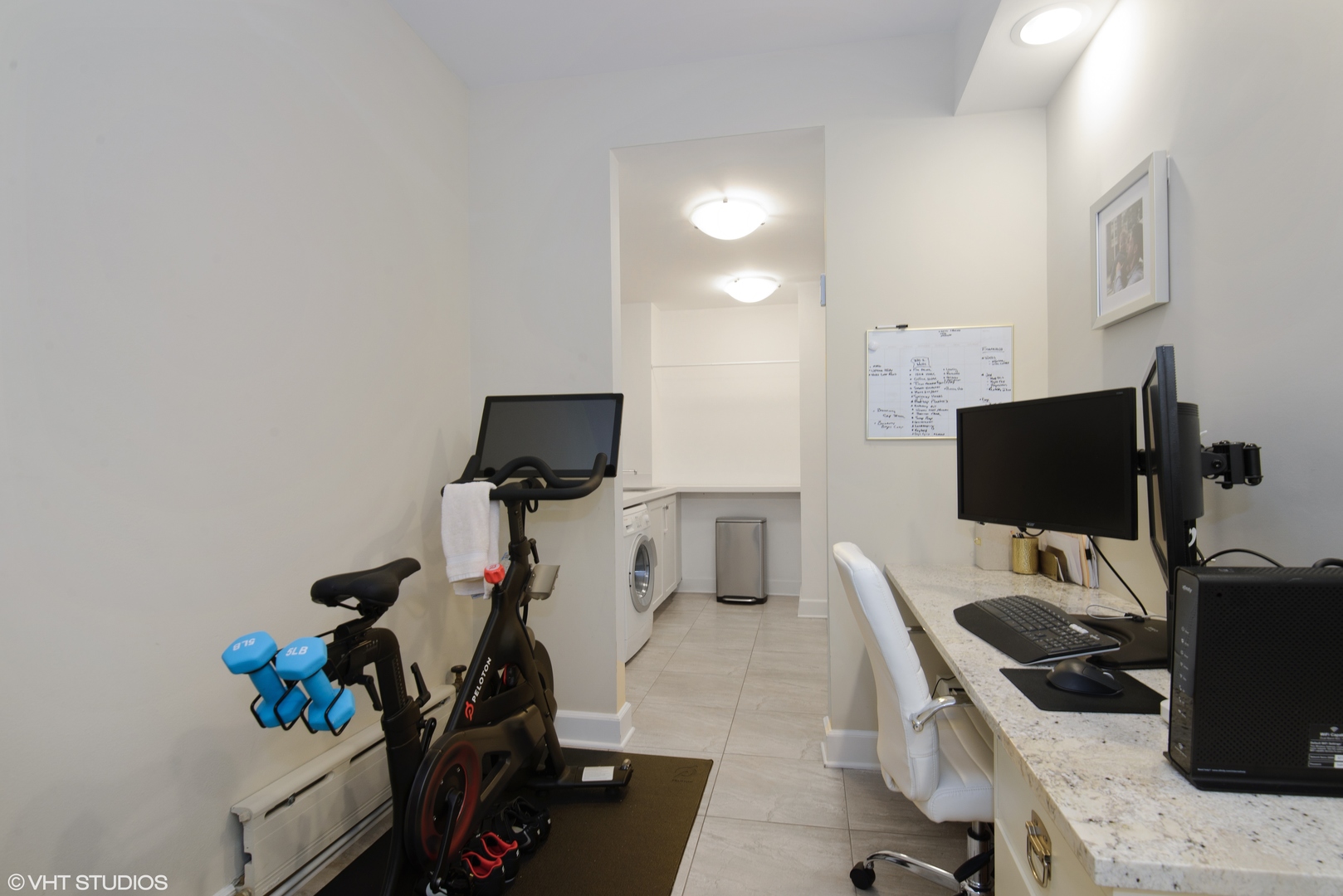 3100 North Sheridan Road, Unit 7D Chicago, IL 60657 - Photo 18 of 24 a view of a workspace with furniture and a flat screen tv