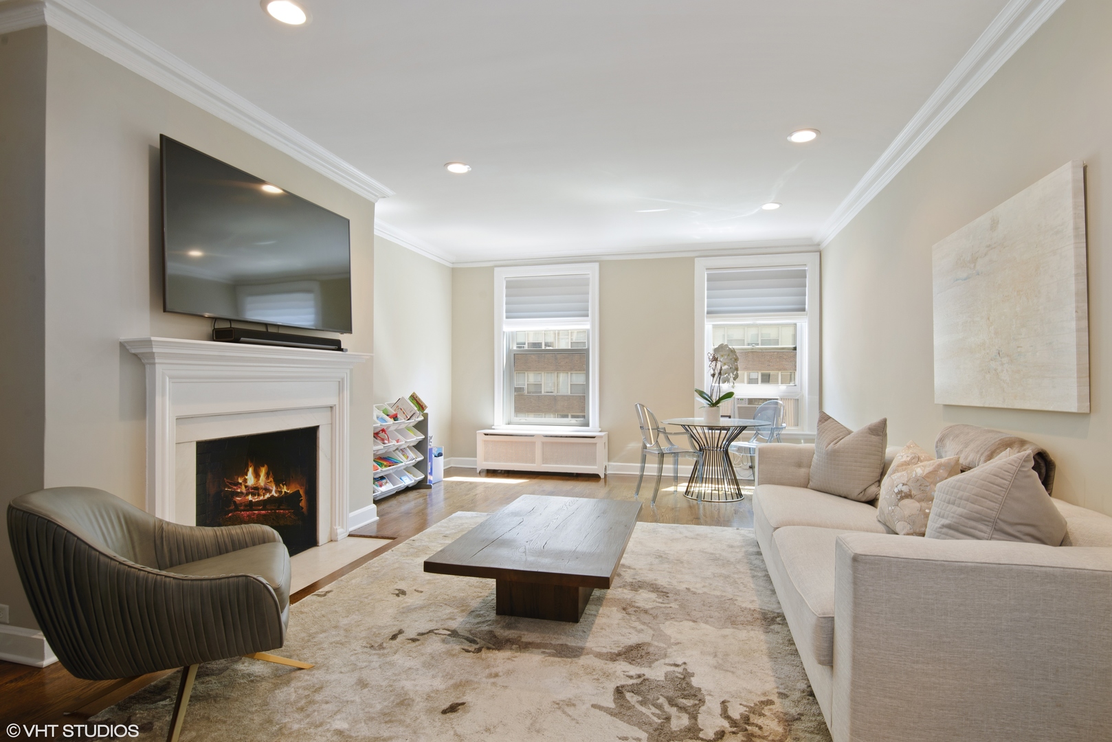 3100 North Sheridan Road, Unit 7D Chicago, IL 60657 - Photo 4 of 24 a living room with furniture a flat screen tv and a fireplace