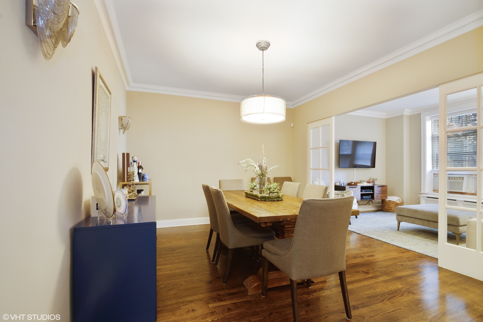 3100 North Sheridan Road, Unit 7D Chicago, IL 60657 - Photo 7 of 24 a view of a dining room with furniture window and wooden floor