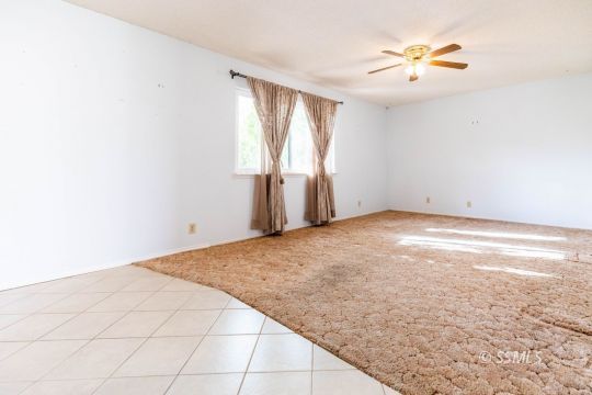 1224 North Inyo Street Ridgecrest, CA 93555 - Photo 11 of 28 an empty room with a natural light
