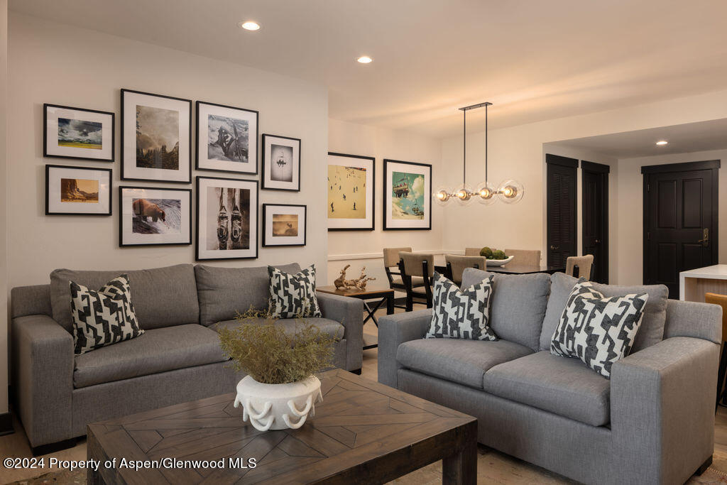 239 Snowmass Club Circle, Unit 111 Snowmass Village, CO 81615 - Photo 8 of 42 a living room with furniture and a couch