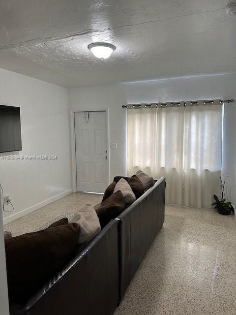 900 Southwest 5th Avenue Miami, FL 33130 - Photo 3 of 10 a living room with furniture and a window