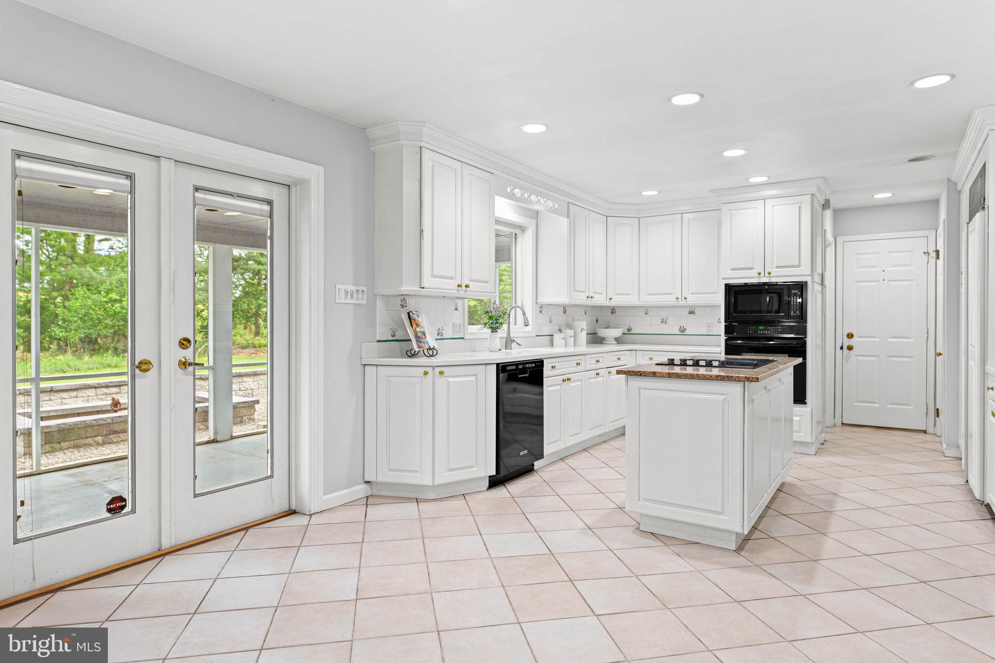 533 Gulph Road Wayne, PA 19087 - Photo 7 of 43 a kitchen with a sink a window and stainless steel appliances