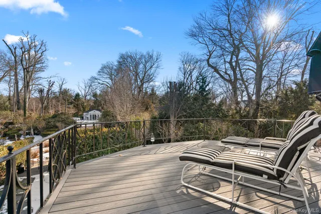 a spacious bathroom with a tub sink and mirror