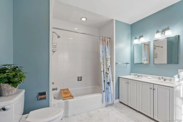 a bedroom with furniture and a wooden floor