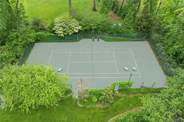 a view of a pathway with a wrought fence