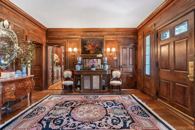 a living room filled with furniture and a rug