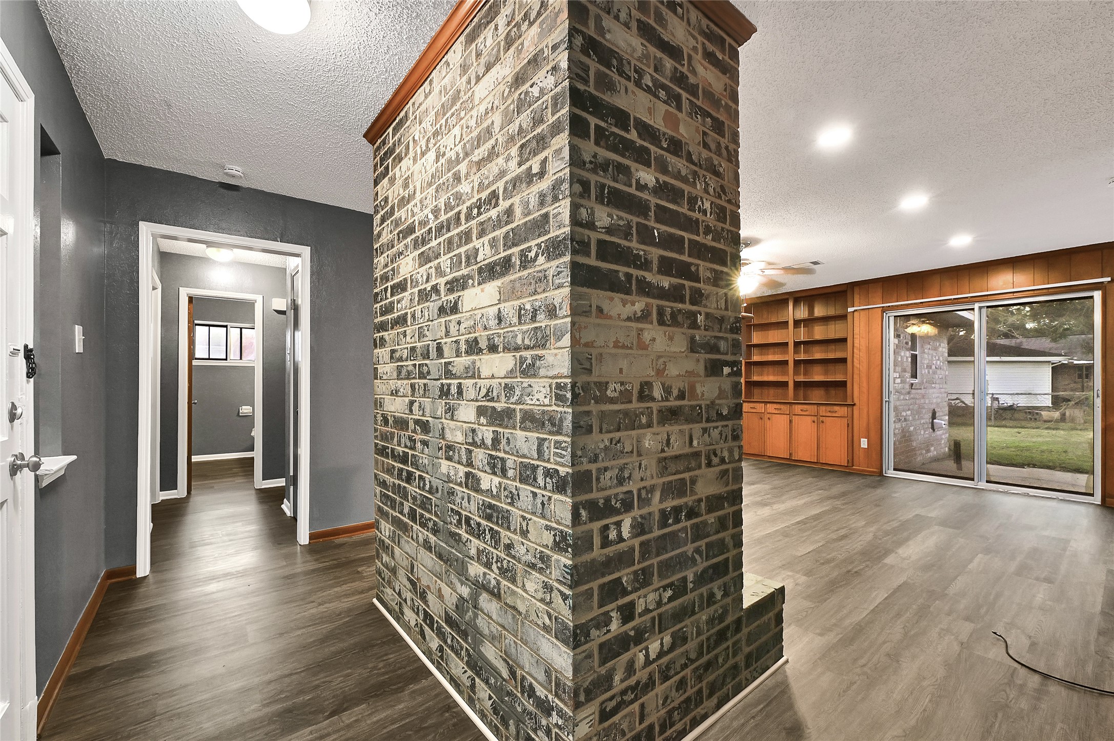 1712 Redwood Circle Alvin, TX 77511 - Photo 6 of 23 wooden floor in an empty room with a window