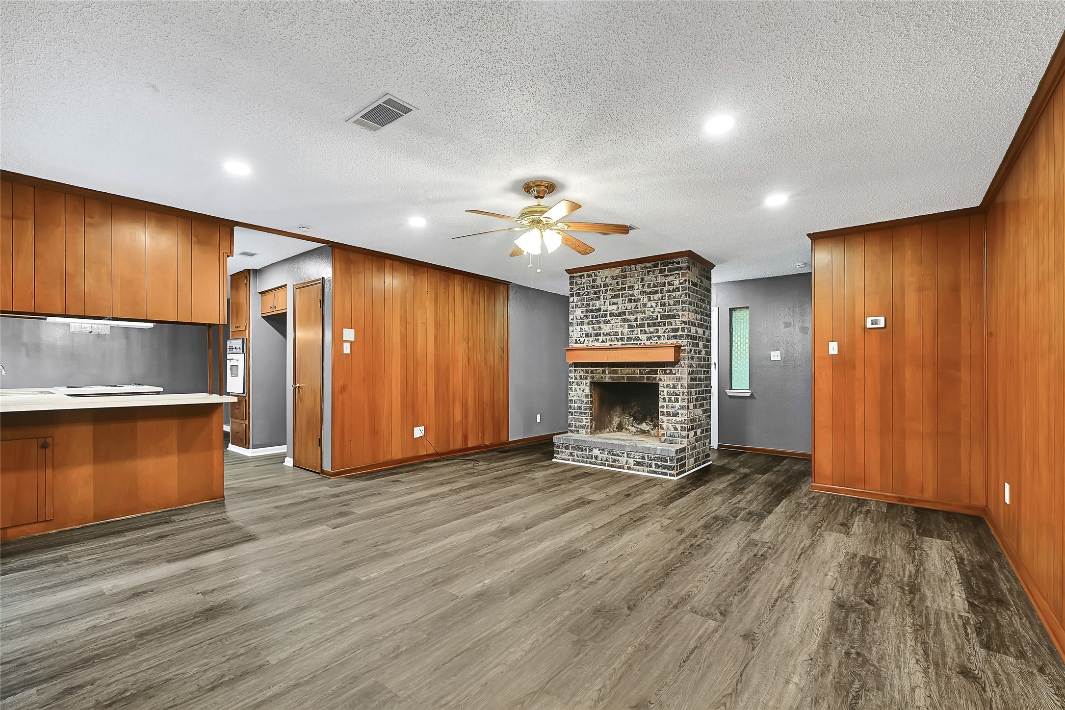 1712 Redwood Circle Alvin, TX 77511 - Photo 8 of 23 a view of an empty room and a kitchen