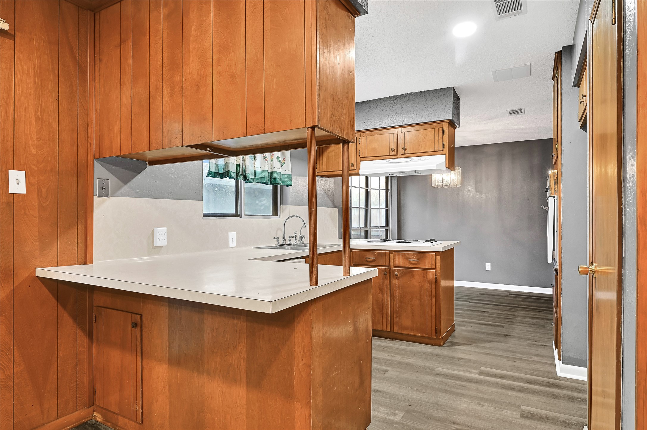 1712 Redwood Circle Alvin, TX 77511 - Photo 9 of 23 a kitchen with stainless steel appliances wooden cabinets and a granite counter tops
