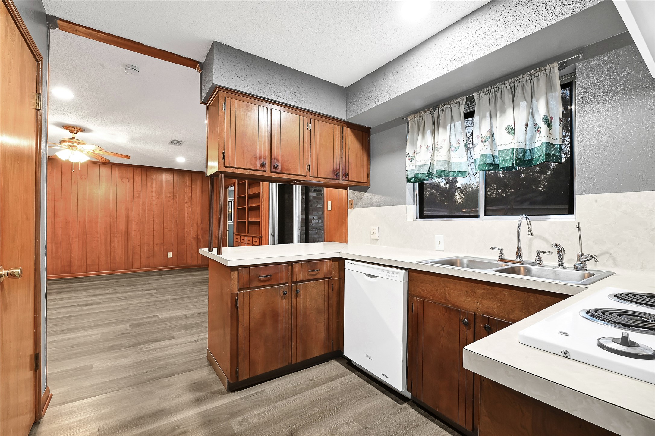 1712 Redwood Circle Alvin, TX 77511 - Photo 10 of 23 a kitchen with stainless steel appliances granite countertop a sink window and cabinets