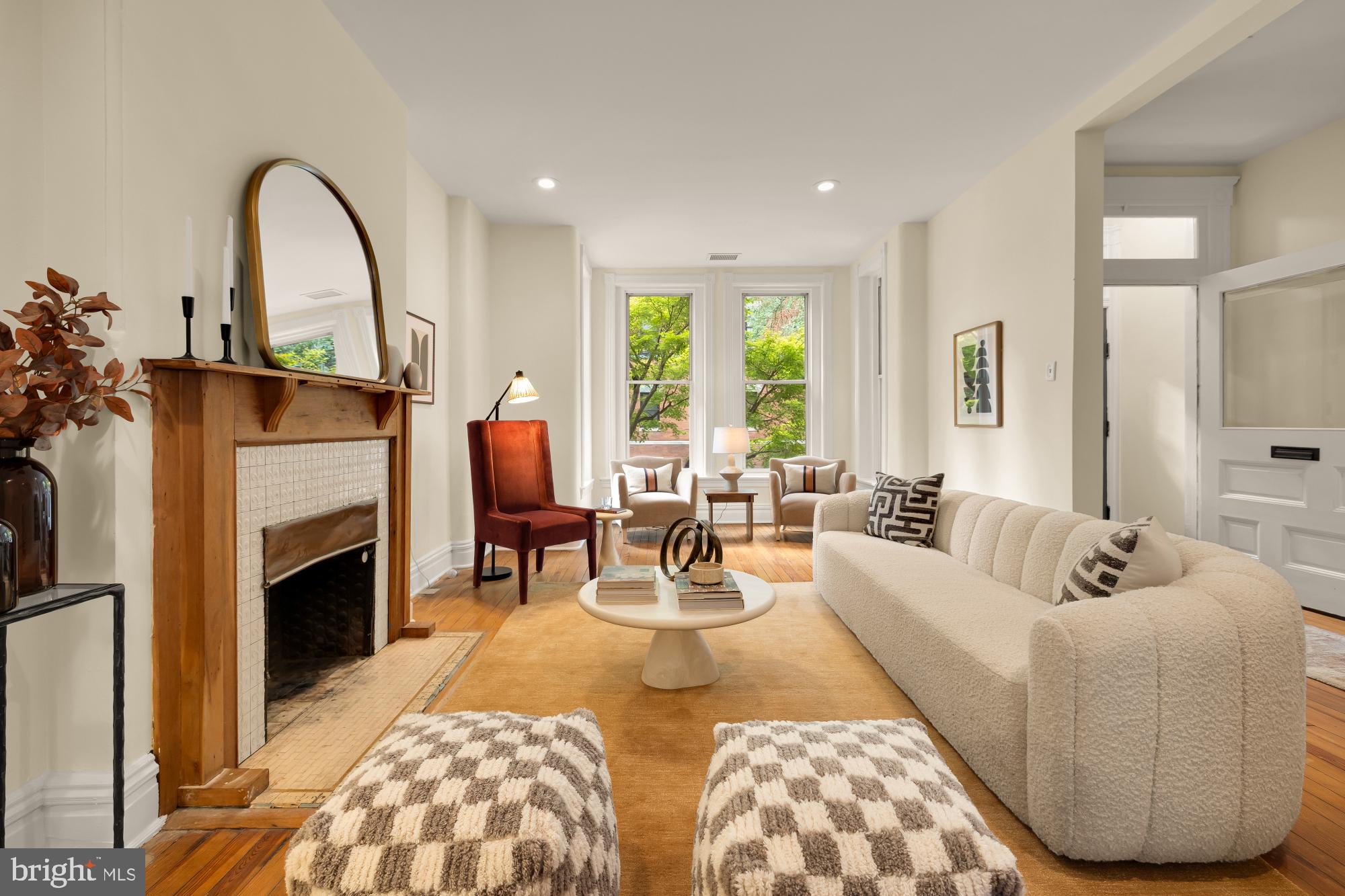a living room with furniture and fireplace